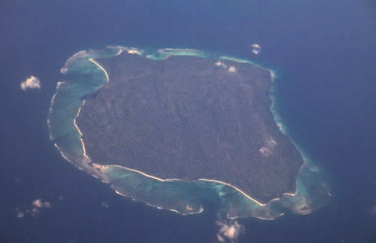 Aerial photograph of North Sentinel Island in the Bay of Bengal - the Indian government enforces a five-nautical-mile no-approach zone around its coastline
