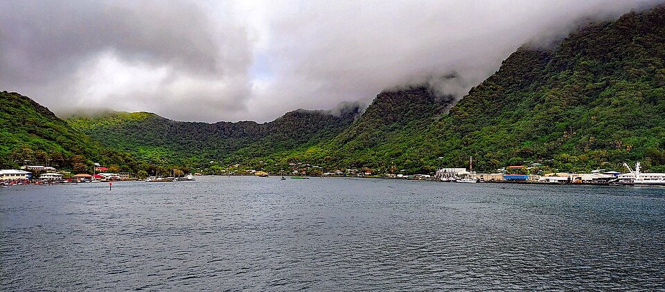 Harbor at Pago Pago, American Samoa, ringed by steep green volcanic ridges