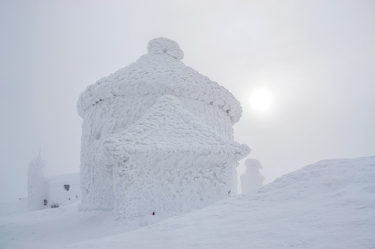 The ice-encrusted chapel of St Lawrence on the summit of Śnieżka in the Karkonosze mountains, Poland, in winter