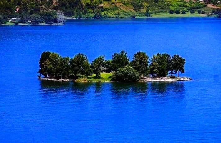 A green island in the blue waters of Lake Kivu, which holds dangerous dissolved gases in its depths on the Rwanda-Congo border