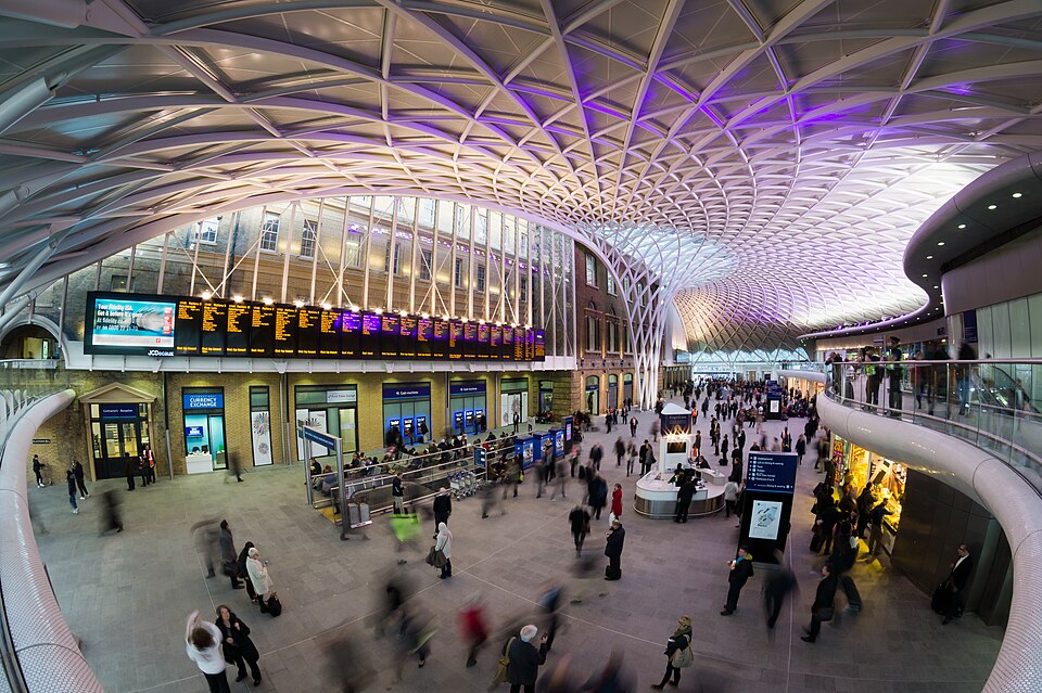 The Platform 9 3/4 trolley installation at King's Cross station in London with Harry Potter branding