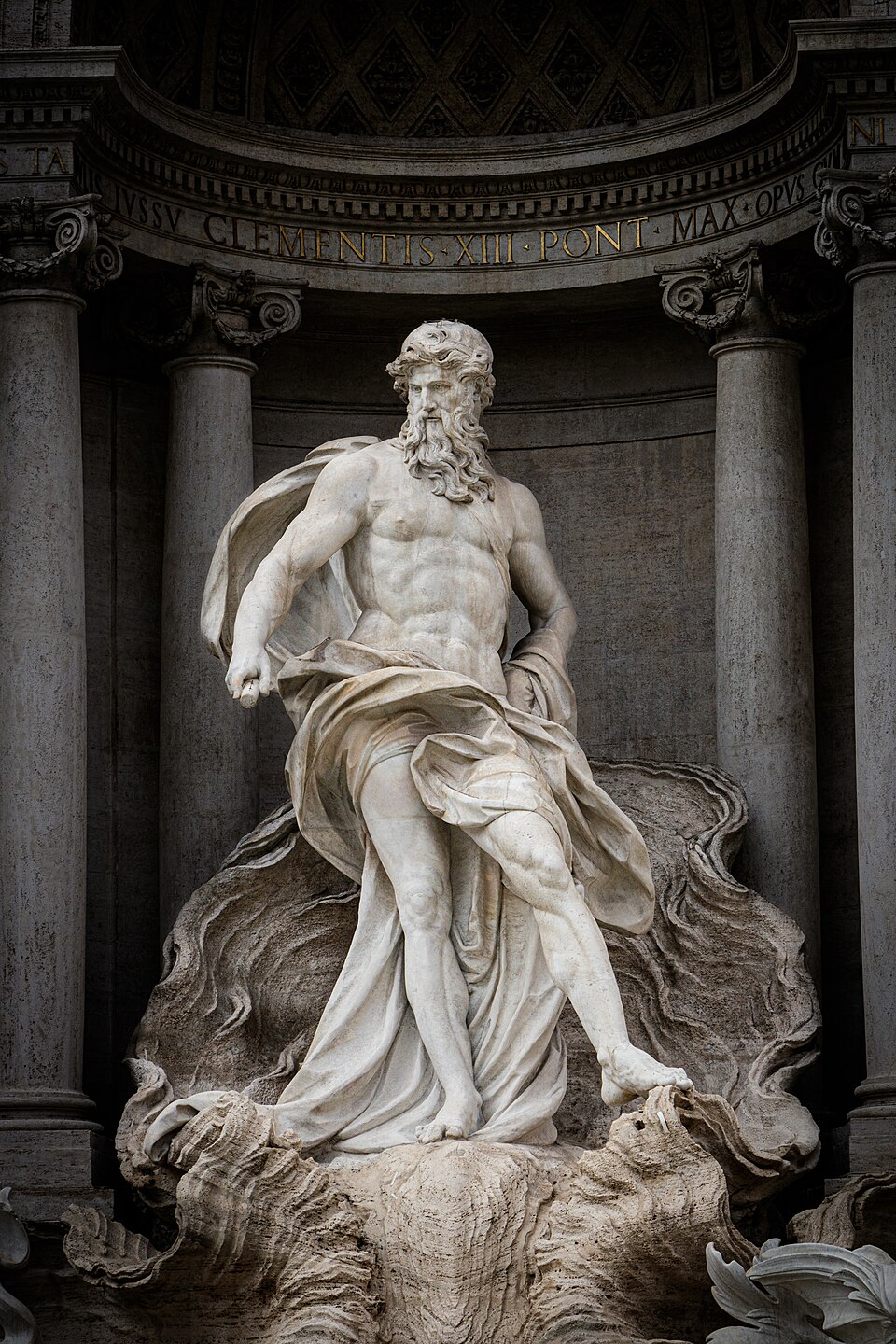 The baroque Trevi Fountain in Rome with statues and water cascading into the basin