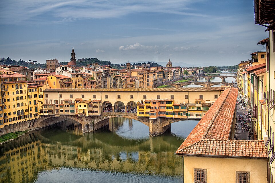 The Ponte Vecchio bridge over the Arno River in Florence at golden hour