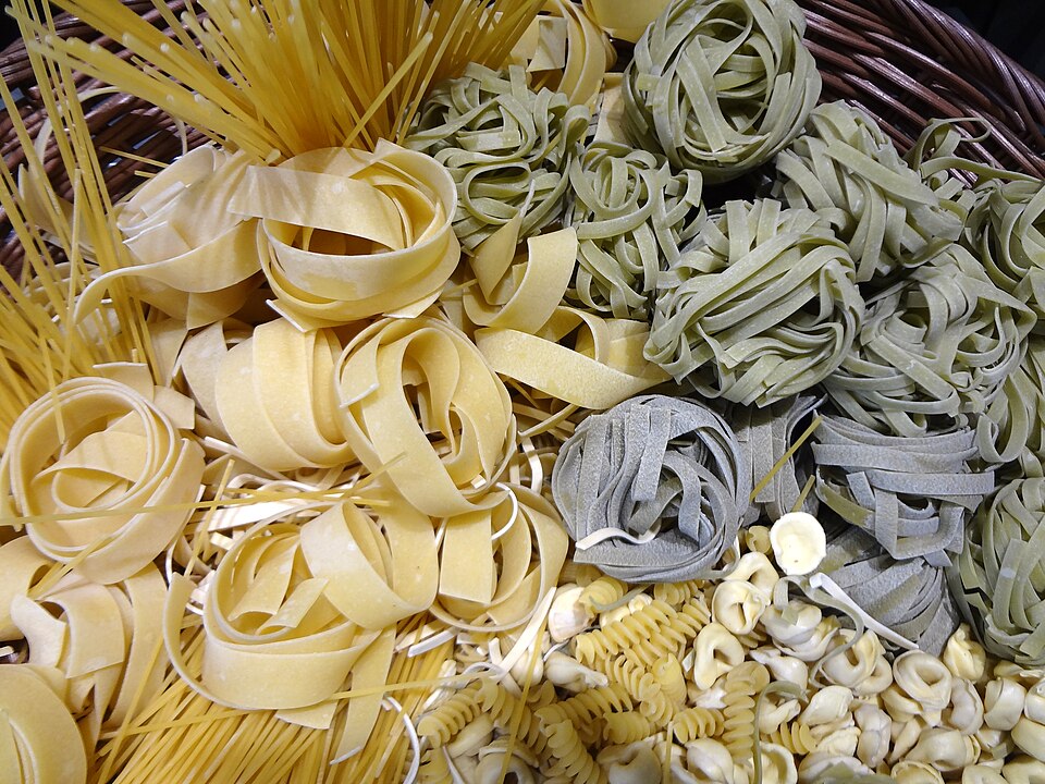 Fresh pasta being made by hand - a craft now considered sufficiently artisanal to justify a menu price of approximately 2,000 percent above ingredient cost.