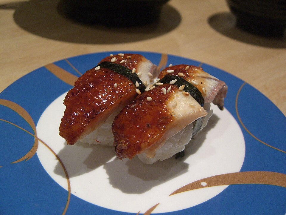 A plate of nigiri sushi - the refined descendant of Edo-period Tokyo street food, now priced as though the rice has been personally blessed.