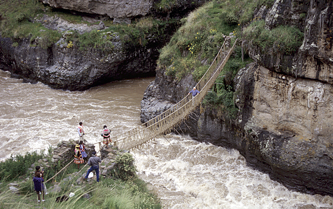 The Q'eswachaka Inca rope bridge, hand-woven from grass, spanning a river gorge in Peru