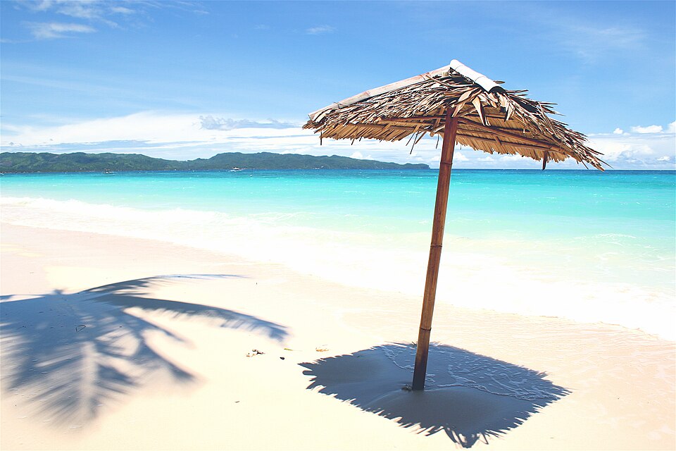 White sand beach and turquoise water of White Beach on Boracay Island in the Philippines