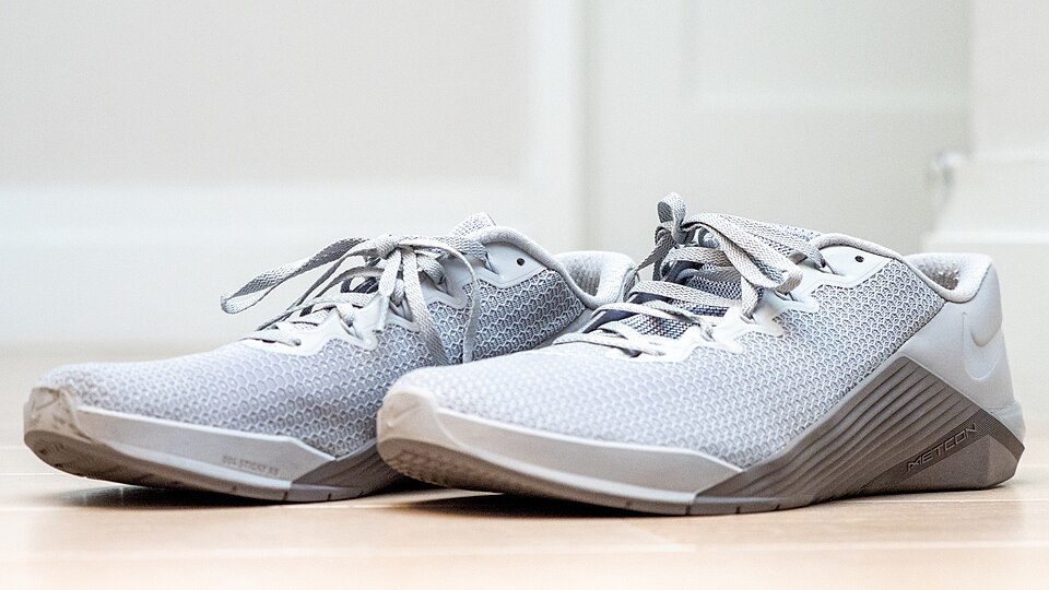 A Nike running shoe resting on a surface, similar to the 80,000 trainers that washed ashore on Pacific Coast beaches in 1990 after a cargo spill