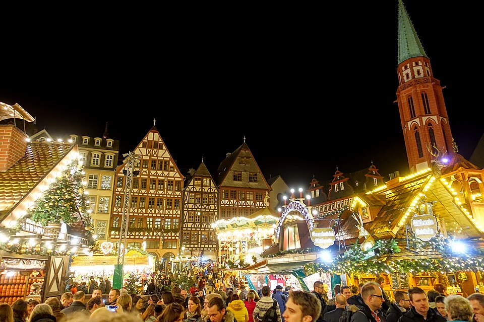 Traditional German Christmas market in Frankfurt with sausage and bratwurst stalls, the culinary tradition from which the hot dog descended