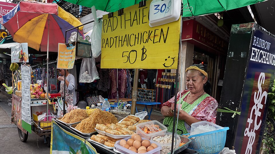 Pad thai being prepared at a Bangkok street food stall - the dish invented by the Thai government during a 1930s rice shortage