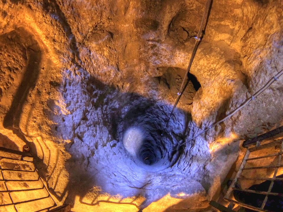 The ancient carved rock passages of Derinkuyu Underground City, descending into the volcanic tufa of Cappadocia, Turkey
