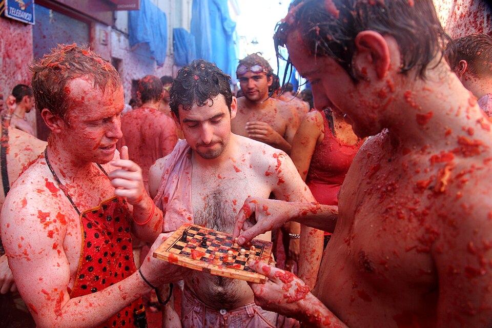 La Tomatina in Buñol, Spain - forty thousand people, one hundred and fifty thousand kilograms of tomatoes, one street, one hour, and an enormous amount of tomato juice.