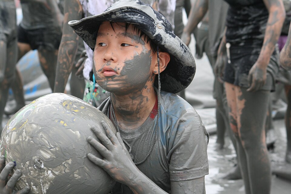 The Boryeong Mud Festival at Daecheon Beach in South Korea - two million annual visitors, all of them intentionally covered in mineral mud for reasons both therapeutic and simply very fun.