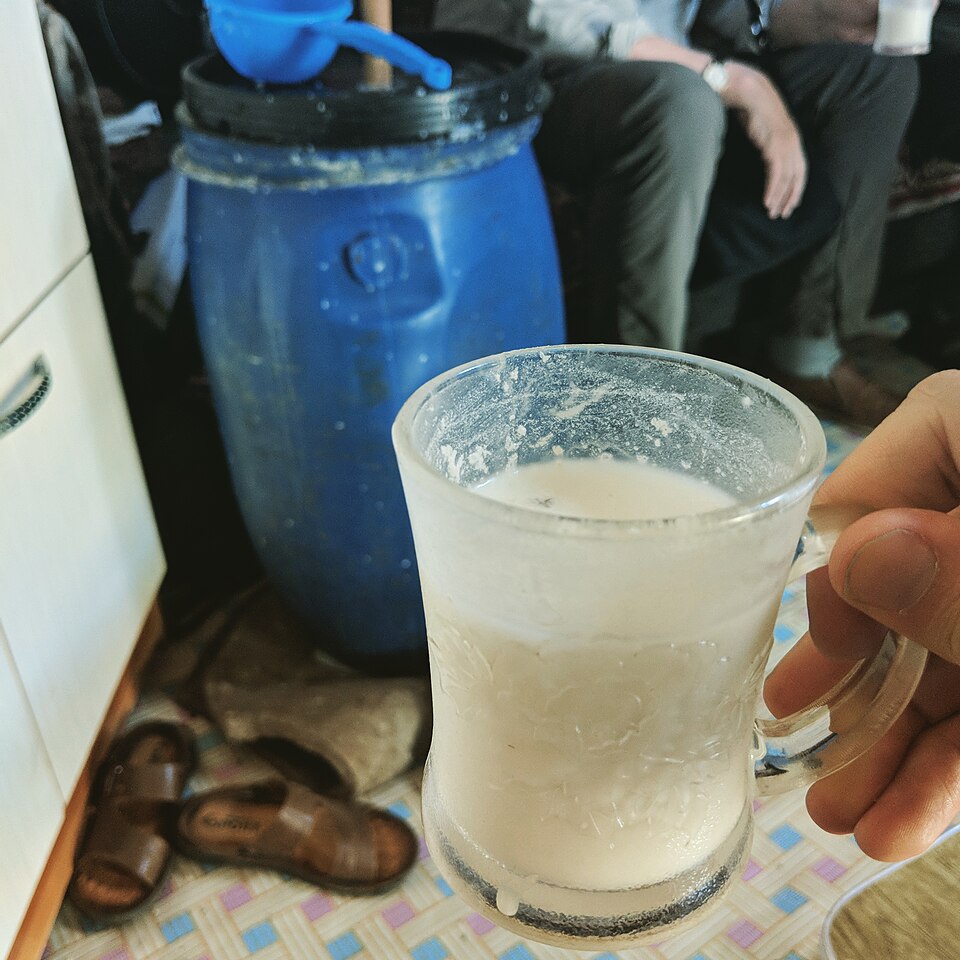 Bowl of airag, the traditional Mongolian fermented mare's milk drink, in a yurt setting