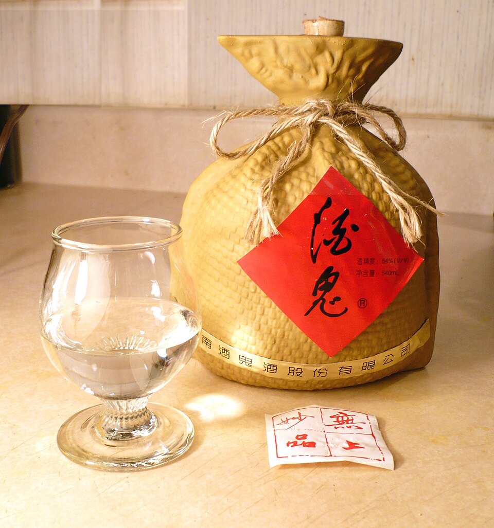 Decorative bottle of Chinese baijiu liquor on a shelf, the base spirit used in three-lizard liquor