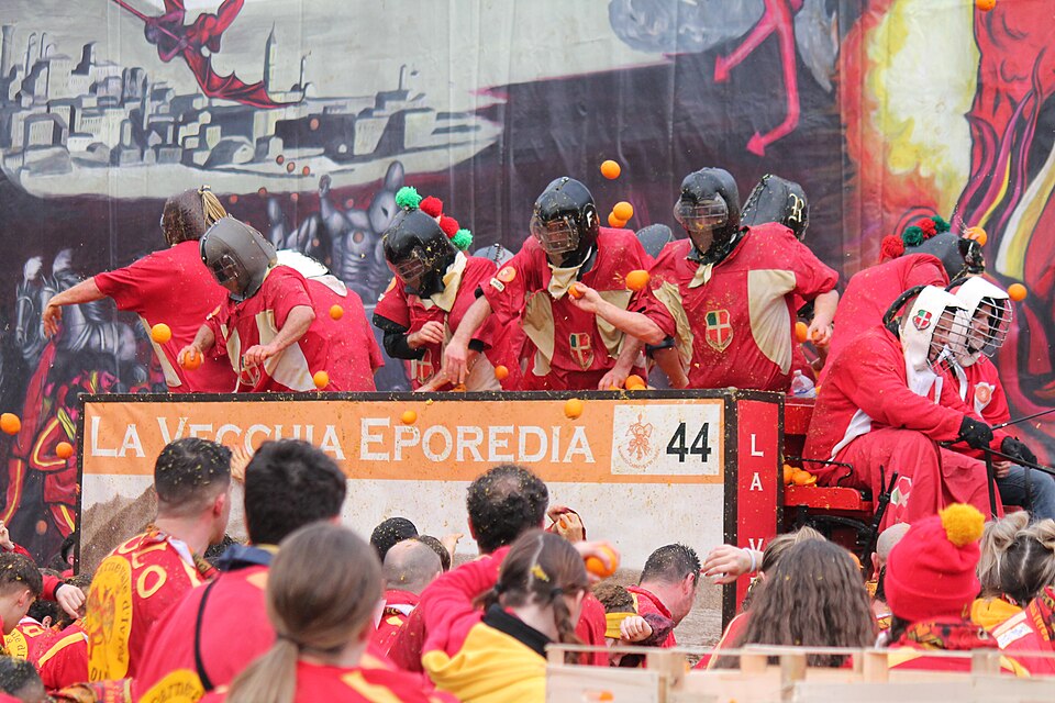 Orange throwers in protective chainmail taking part in the Ivrea Carnival Battle of Oranges historical re-enactment in northern Italy