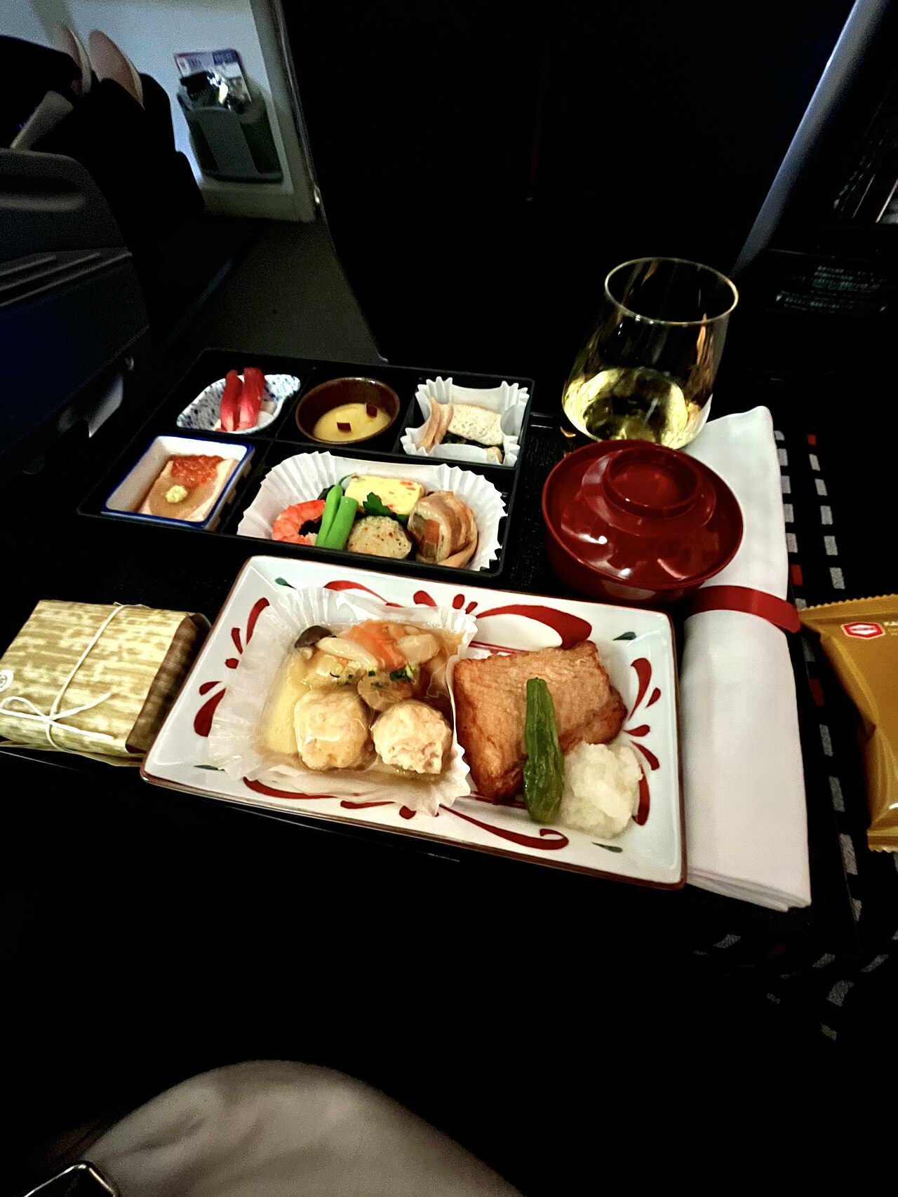 Japan Airlines business class meal tray with multiple courses - business class catering can have ten times the budget of economy and yet still occasionally produces inedible results