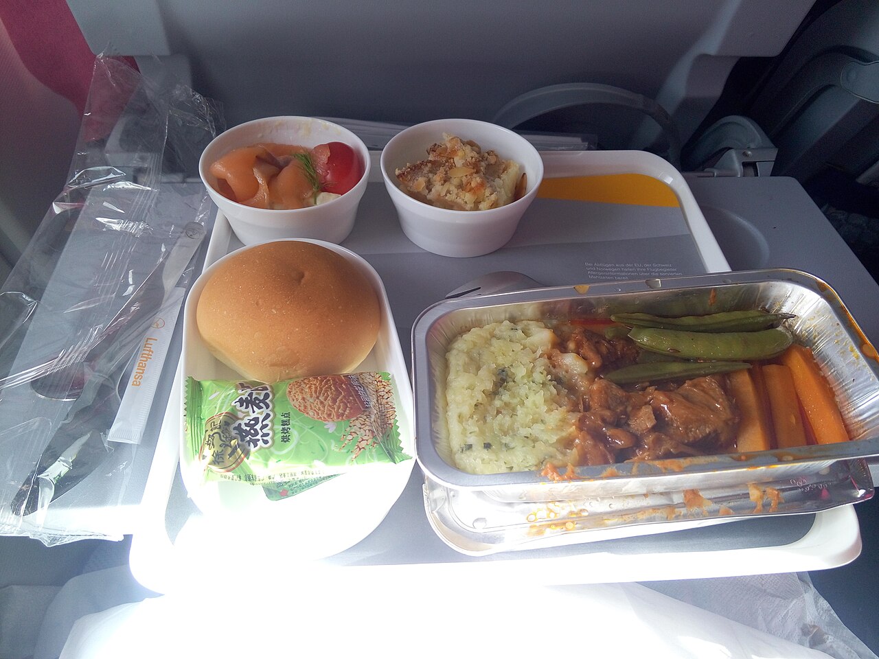 Lufthansa economy class meal tray with multiple compartments - airline economy meals are produced for around three to eight US dollars per passenger including labour and packaging